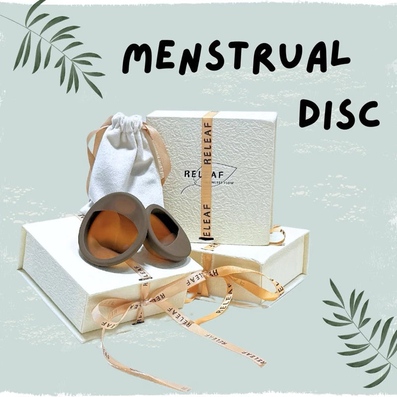 Menstrual disc product with packaging and accessories on a light blue background